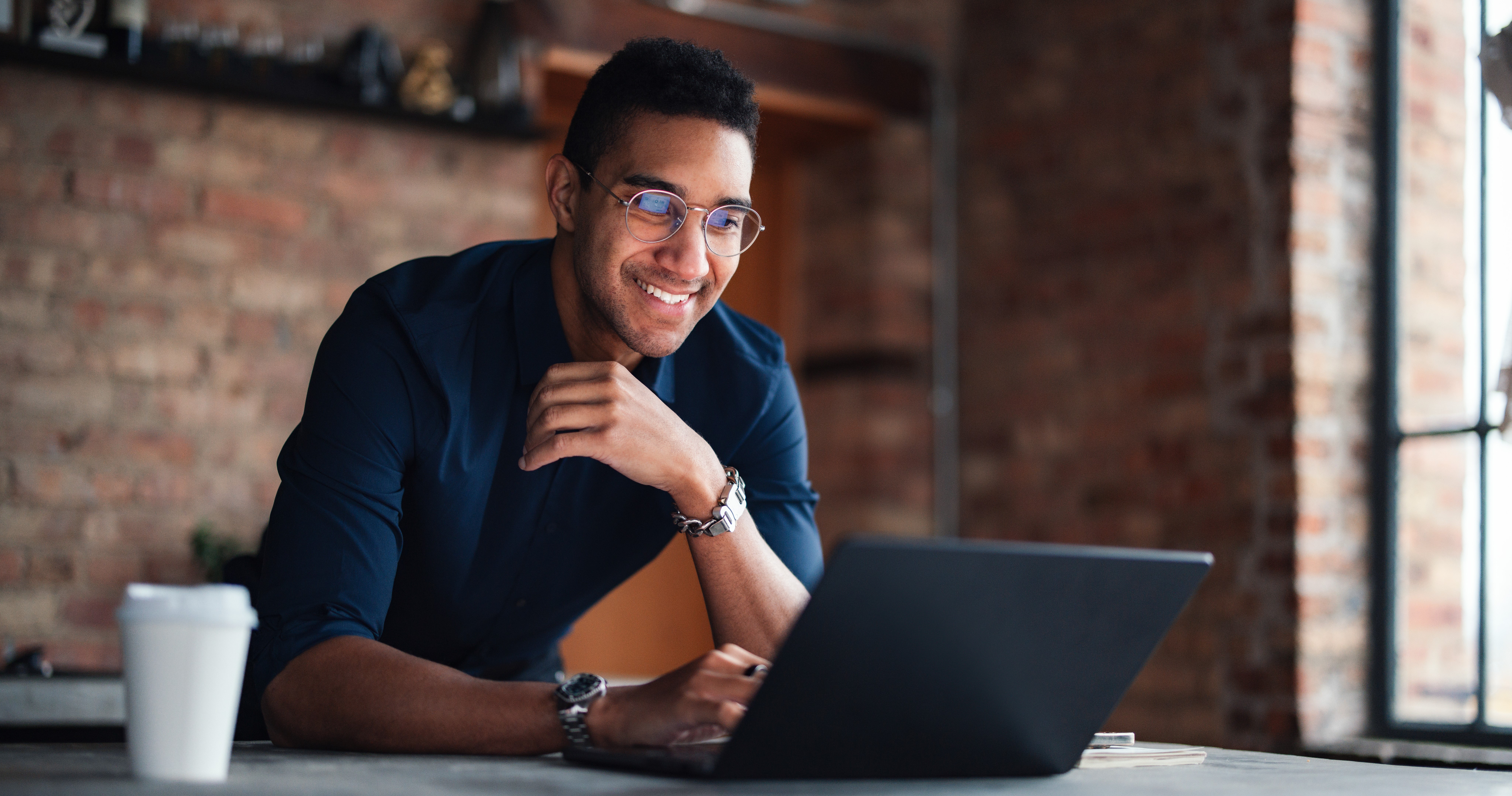 Happy man working on computer