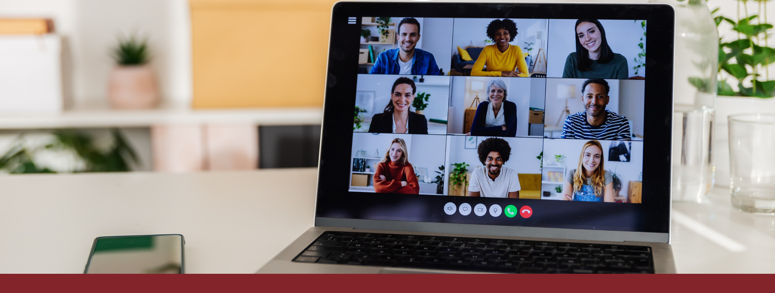 Diverse group in online training on laptop