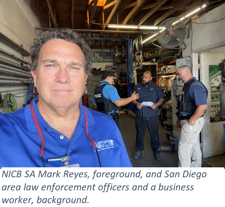 NICB SA Mark Reyes, foreground, and San Diego area law enforcement officers and a business worker, background.