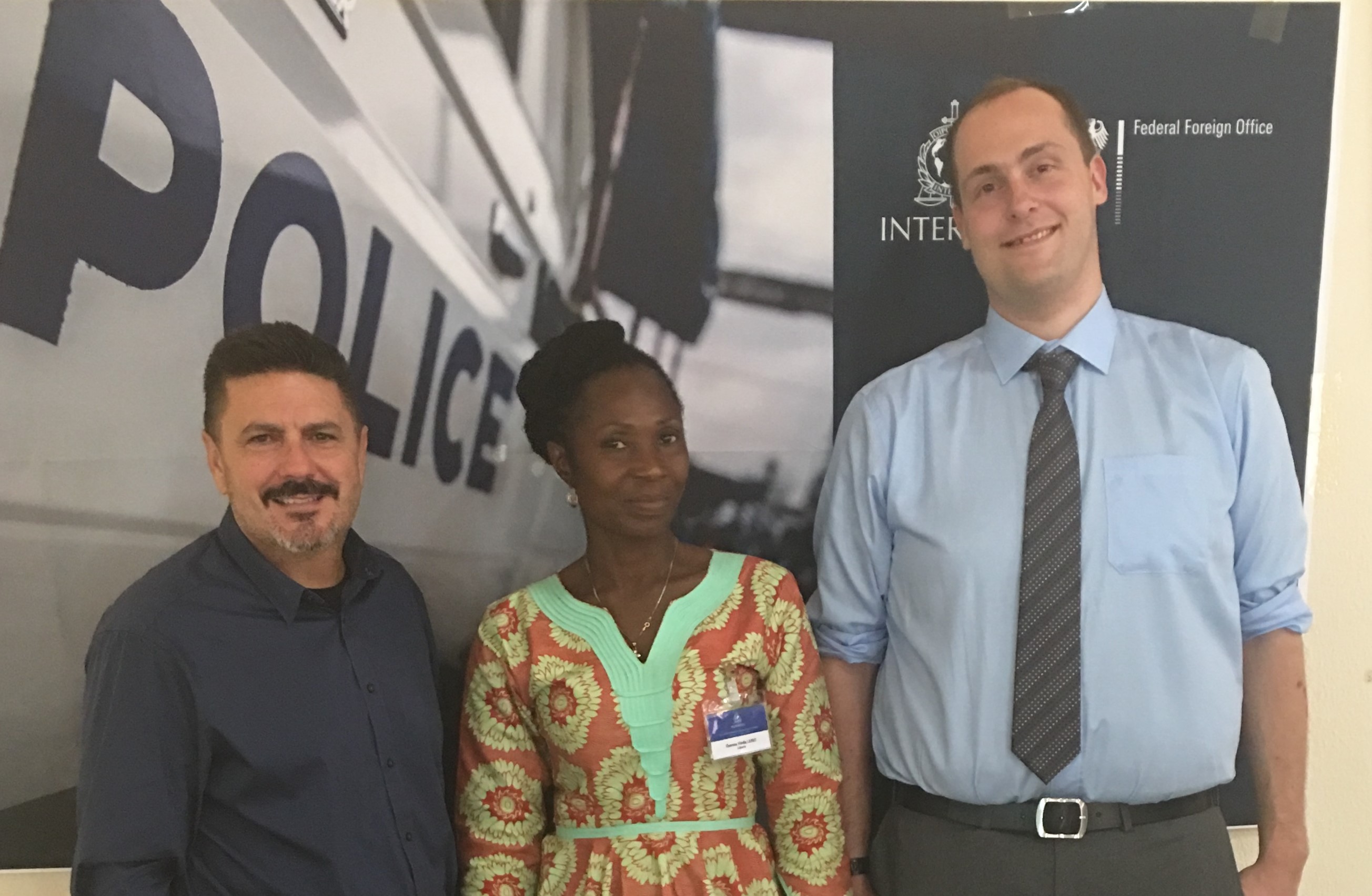 NICB Special Agent Neil Carmody with Ms. Theresa Finda Lebbe of Liberia Customs and Sgt. Nathan Rickets, London Metro Police