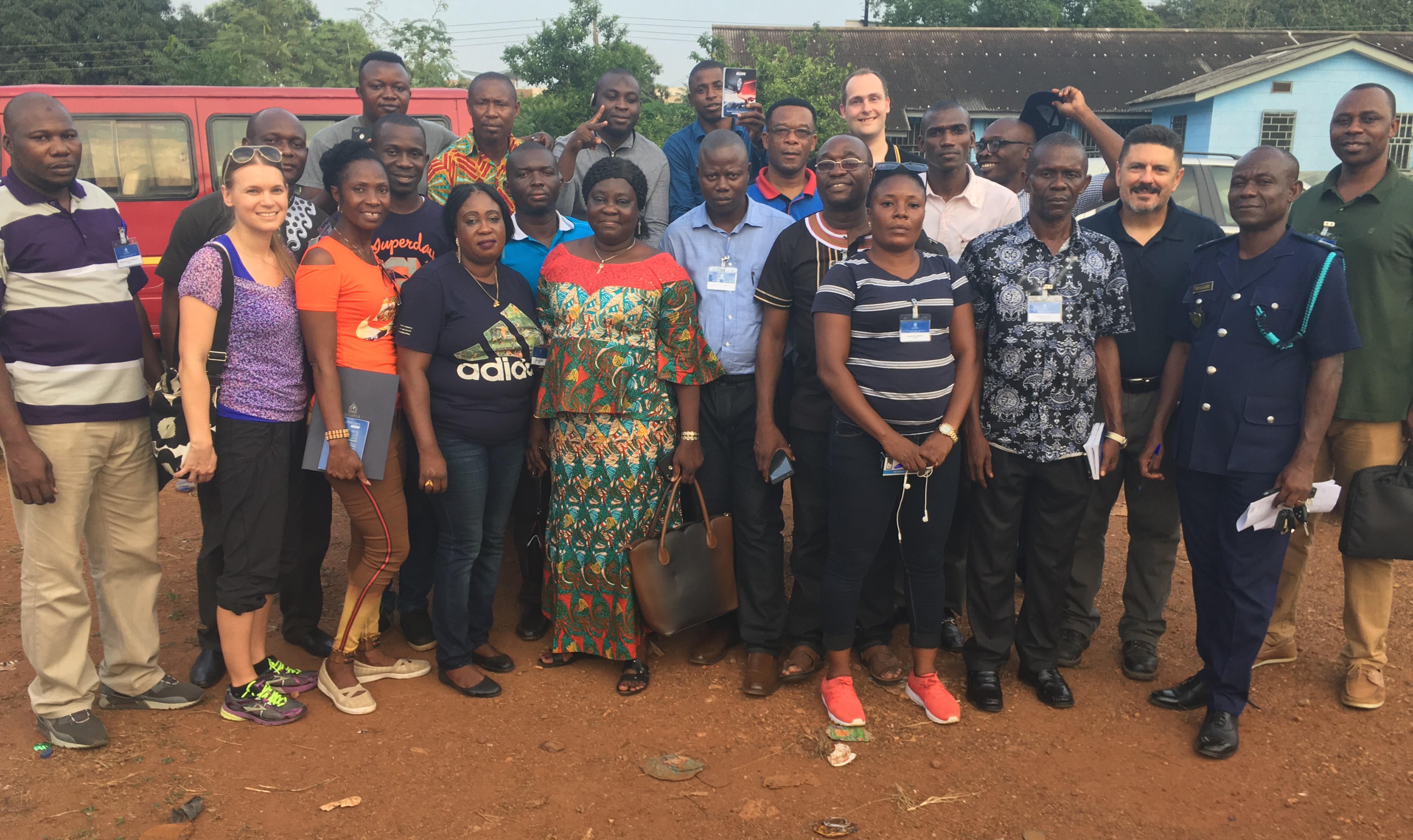 Students, instructors, and INTERPOL officials at a Ghana Customs vehicle impound yard